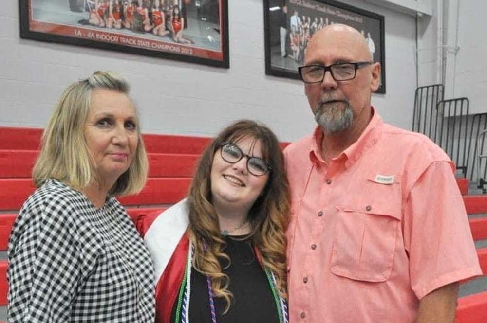 UAFS junior Kimber Campbell, center, with her grandparents Lyshelle, left, and Joe Eyerman. The Eyermans were named the 2023 UAFS Family of the Year.