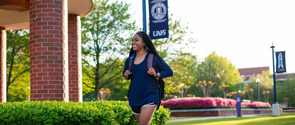 student walking on campus