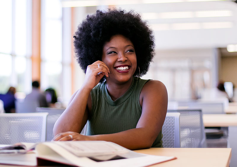 student in library