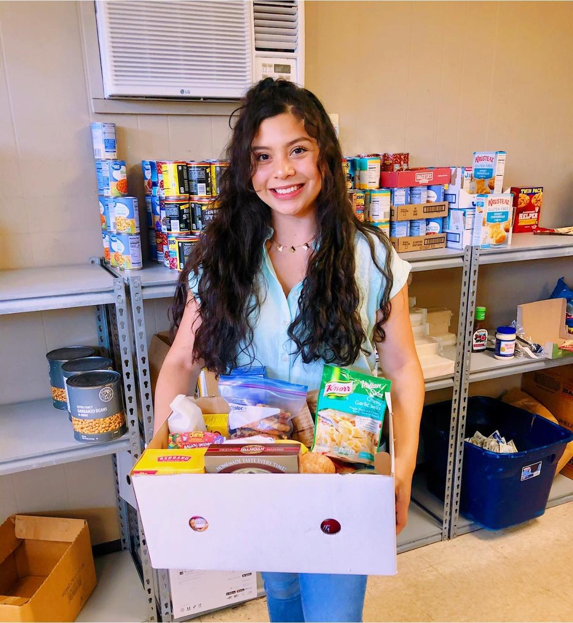 Cecilia Flores provides food to cancer patients at the Community Services Clearinghouse.