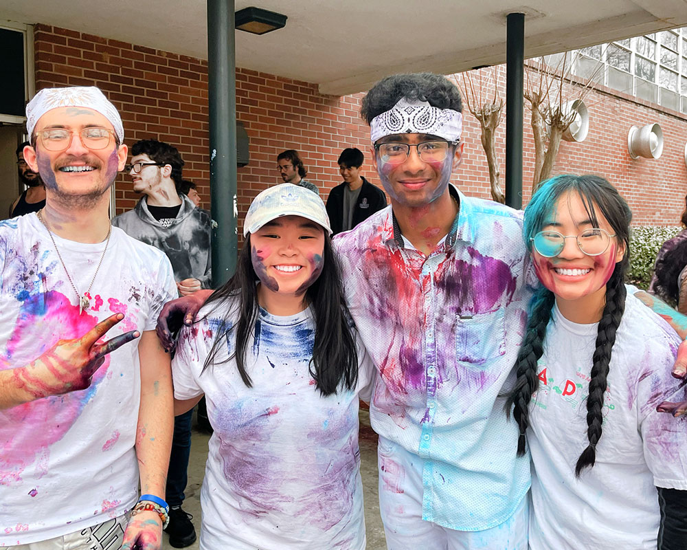 Desi Culture Club students pose for photo during Holi celebration