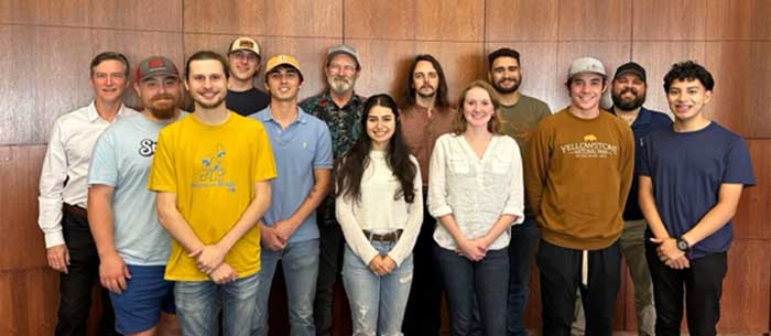 Dr. Marsh Lavenue, back left, meets with UAFS geology students and professors during recent visit to campus