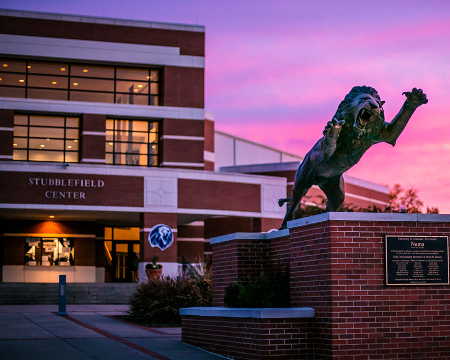 Statue of Numa, the UAFS mascot, at sunset in front of the Stubblefield Center