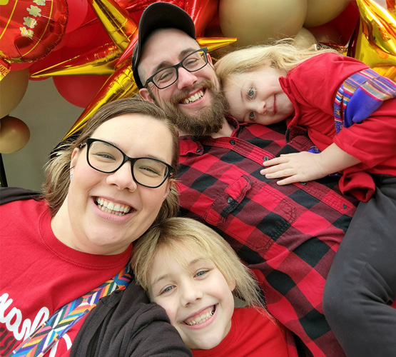 Sarah Murrah, left, with her husband and two daughters