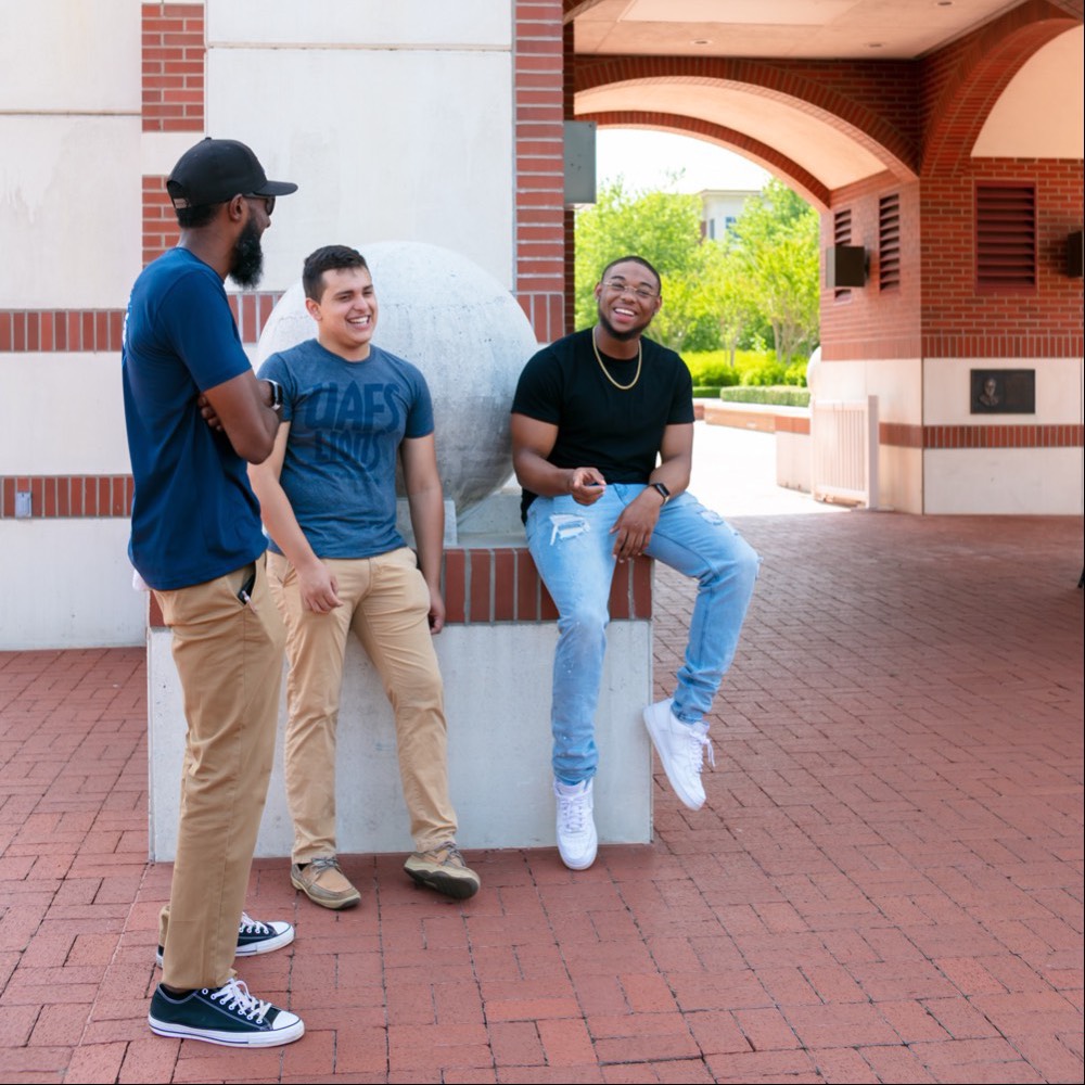 three men on the UAFS campus