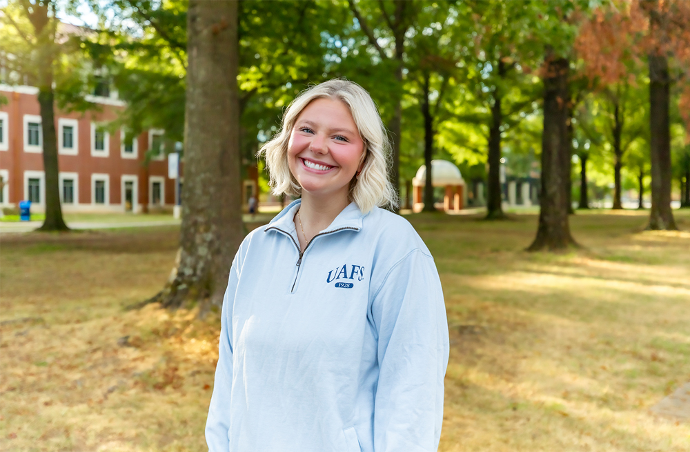 Alyvia Jean Scroggins smiles on the UAFS Campus Green