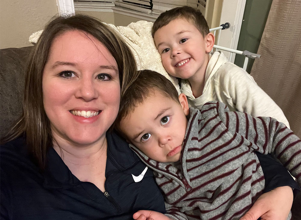 Amanda Seidenzahl, director of early college programs, smiles with her two sons