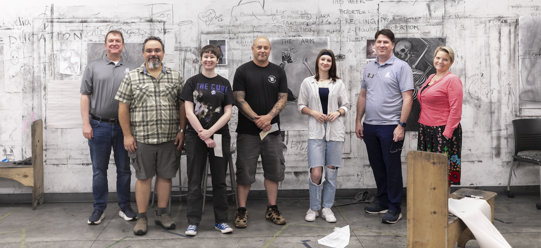 art students and anatomy professors pose together in the drawing studio