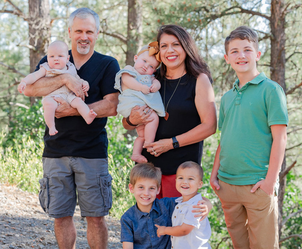 Dr. April Evans, center, surrounded by her husband, Shane, and their five grandchildren