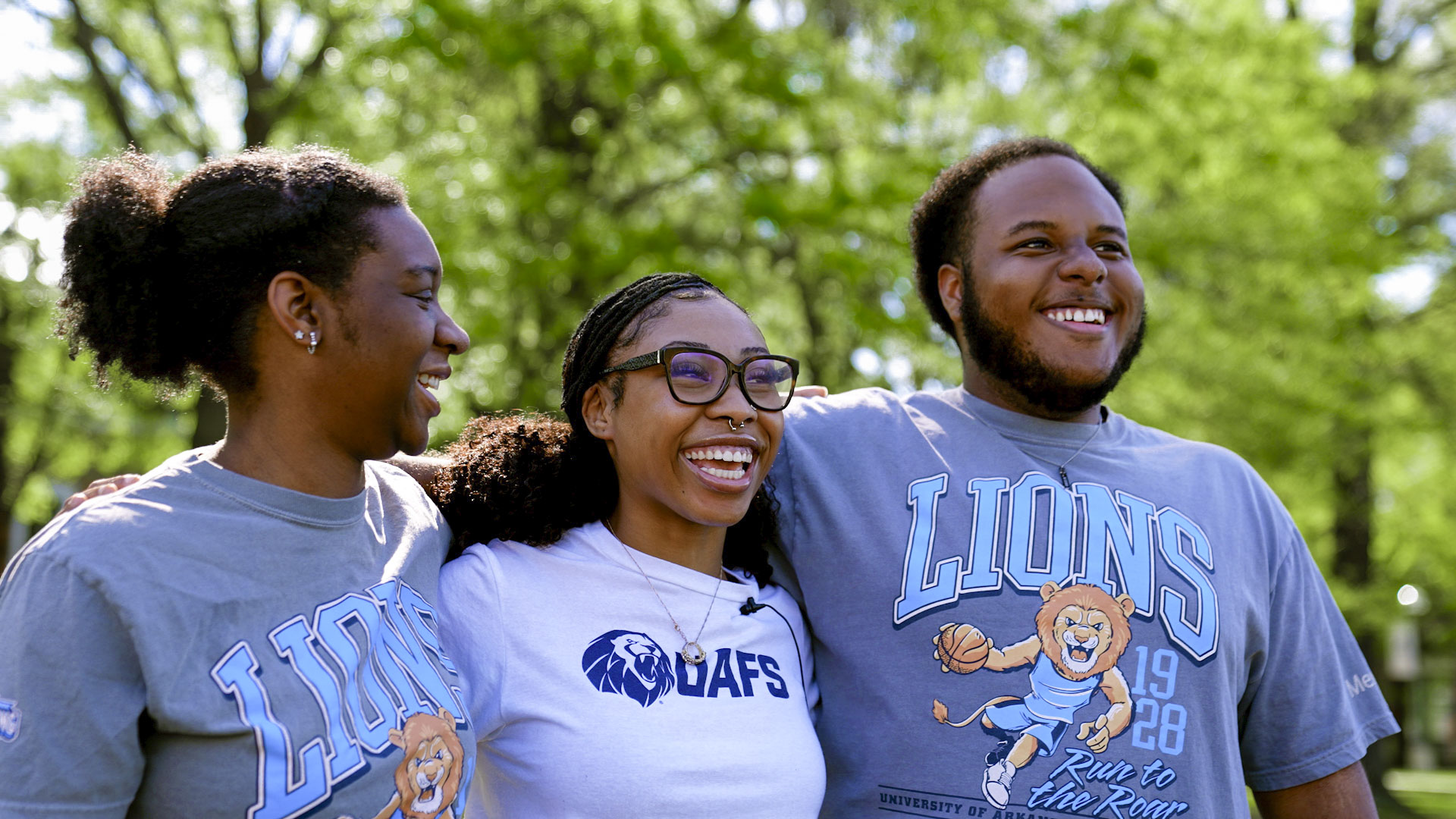 three students in the UAFS Black student alliance pose during a Day of Giving photoshoot