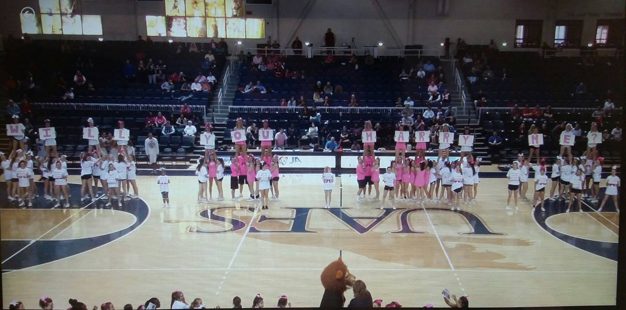 Cheerleaders spell out Will You Marry Me