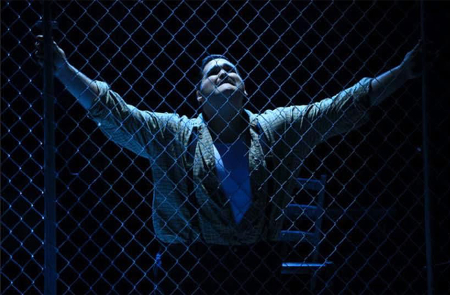 Chris Lopez, '09, performs in an opera performance.