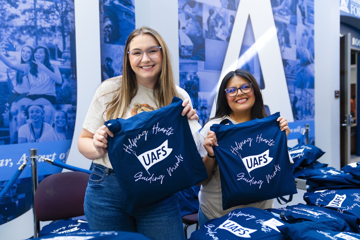 Darbi Owen and Betsy Corona pose with gift bags at the annual Couselor's Brunch