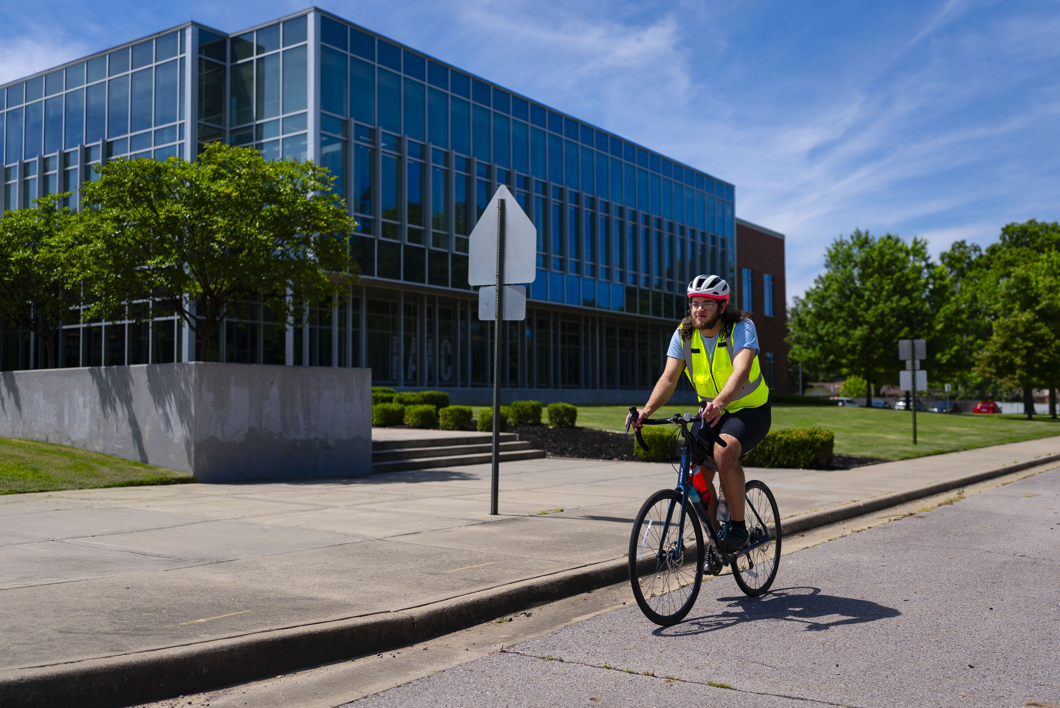 Danu on his bike on the UAFS campus before he sets off for Journey of Hope