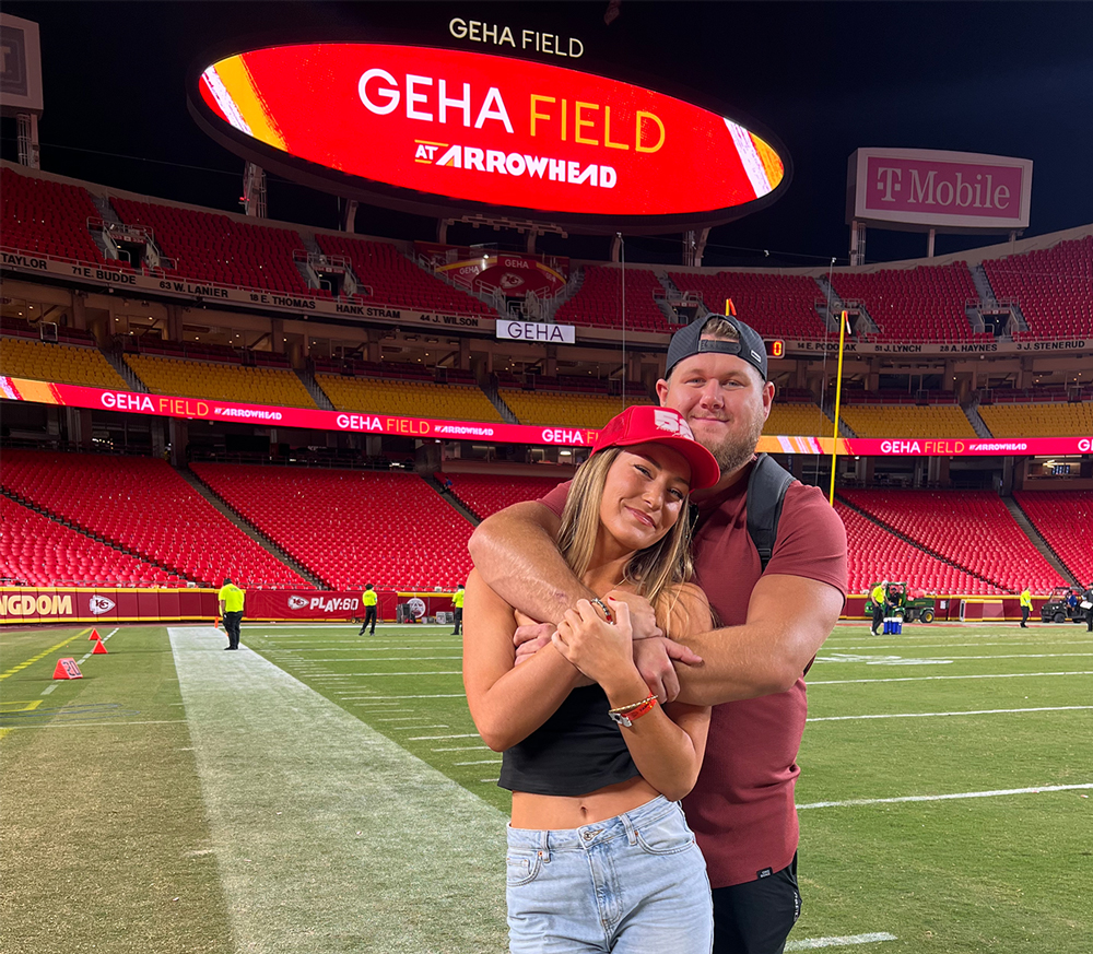 Ana Demmer, '20, embraces her boyfriend, Kansas City Chiefs center Creed Humphrey, at Arrowhead Stadium.