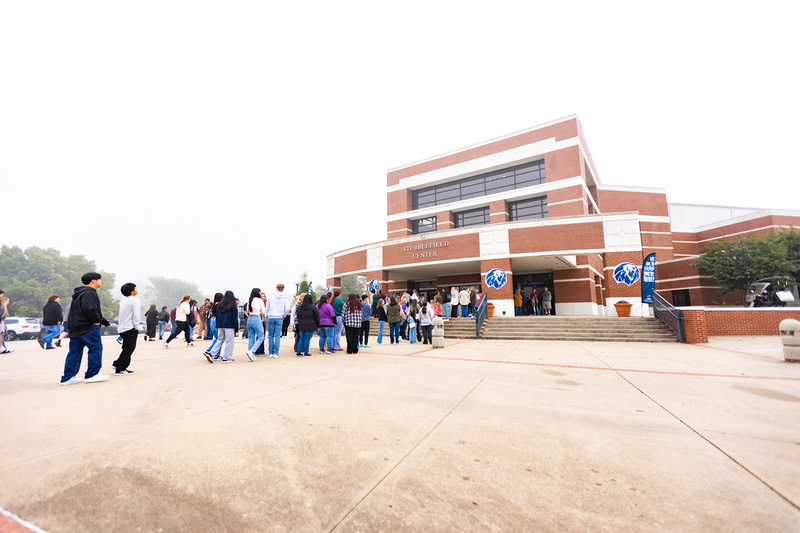 A line of students waited to check in outside of the UAFS Stubblefield Center for historic Den Day.