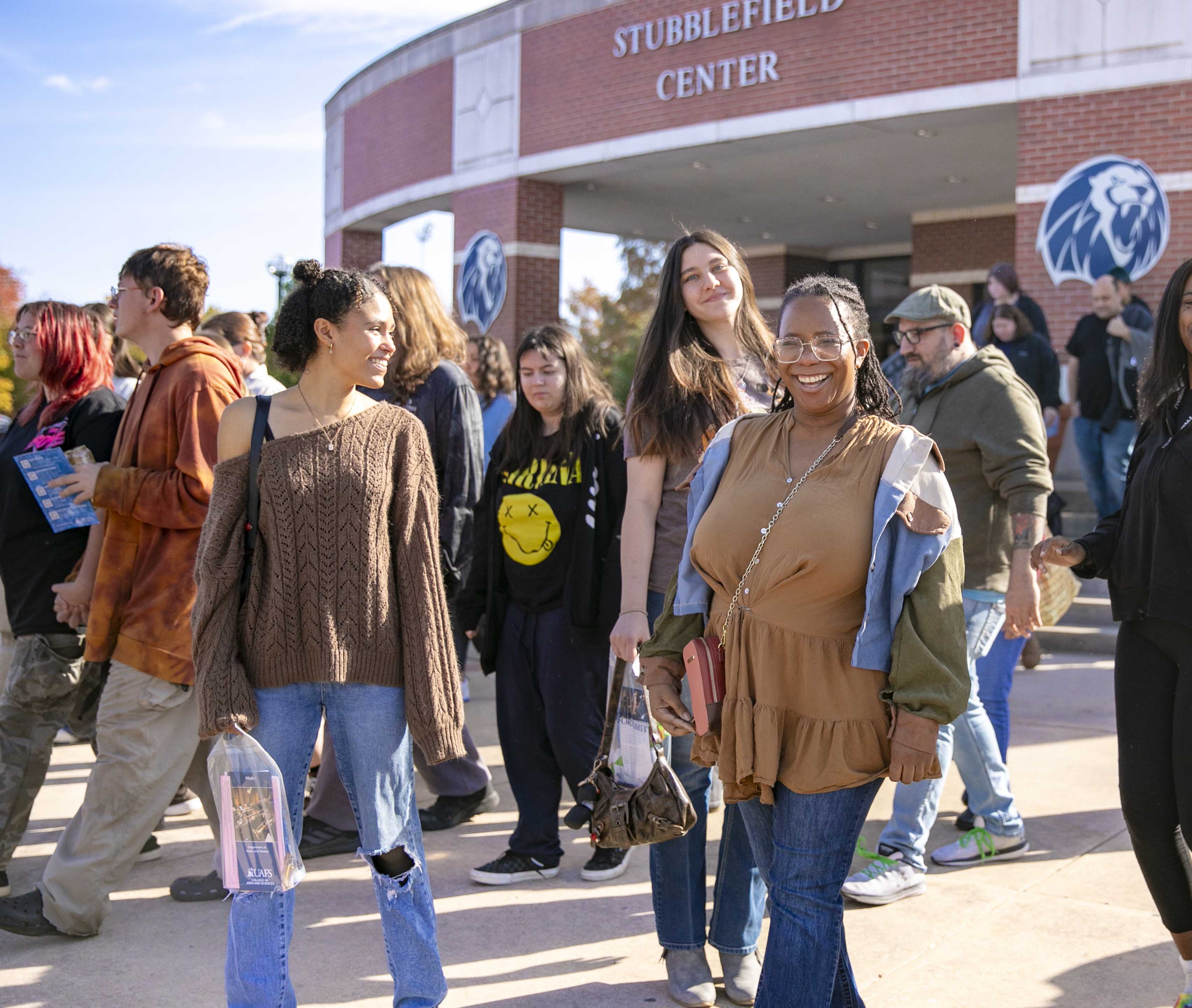 Students and parents walk to their campus tours during UAFS Den Day