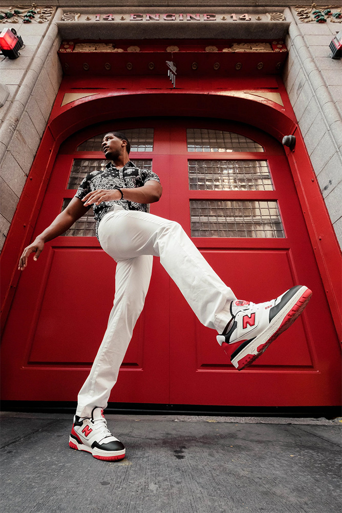Chukwukere Ekeh poses in front of a firehouse door. Courtesy Jesh Anies