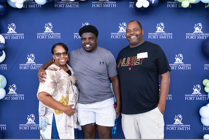 a family poses for a photo at Mane Event