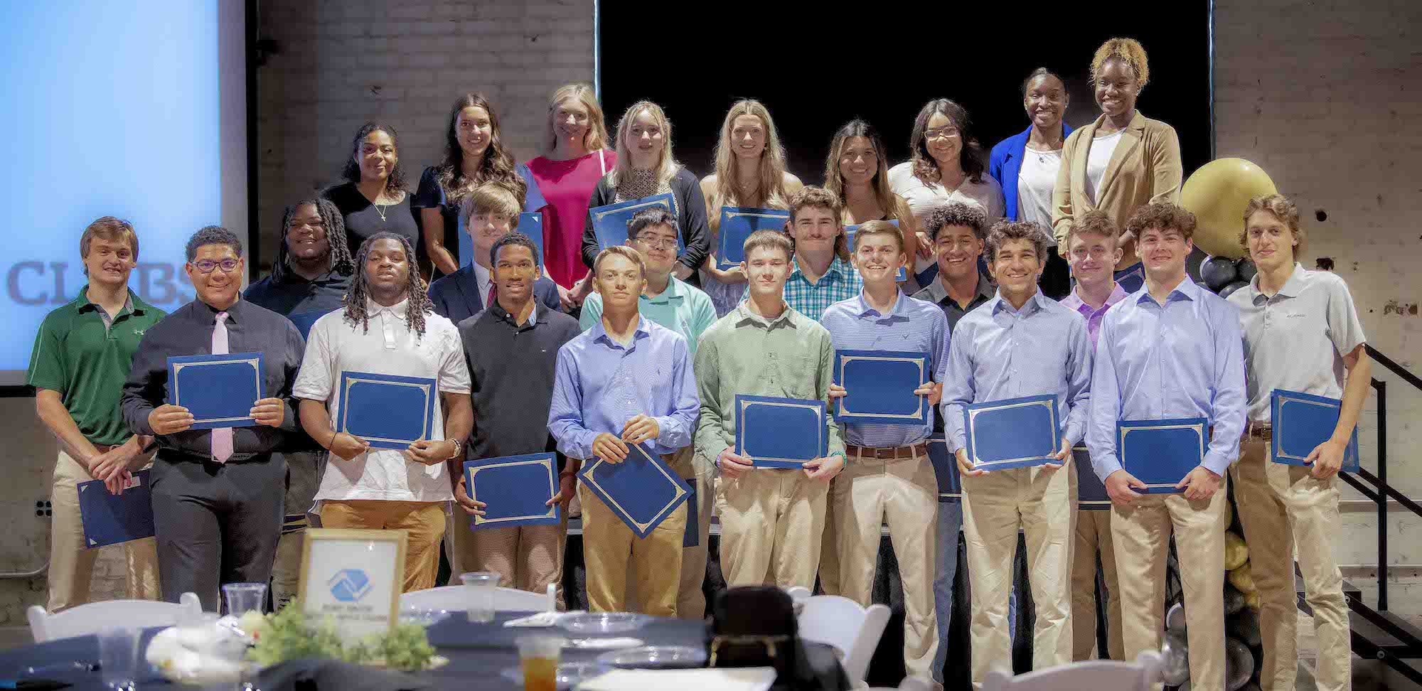 The 2023 FSBGC scholarship recipients hold their awards. 