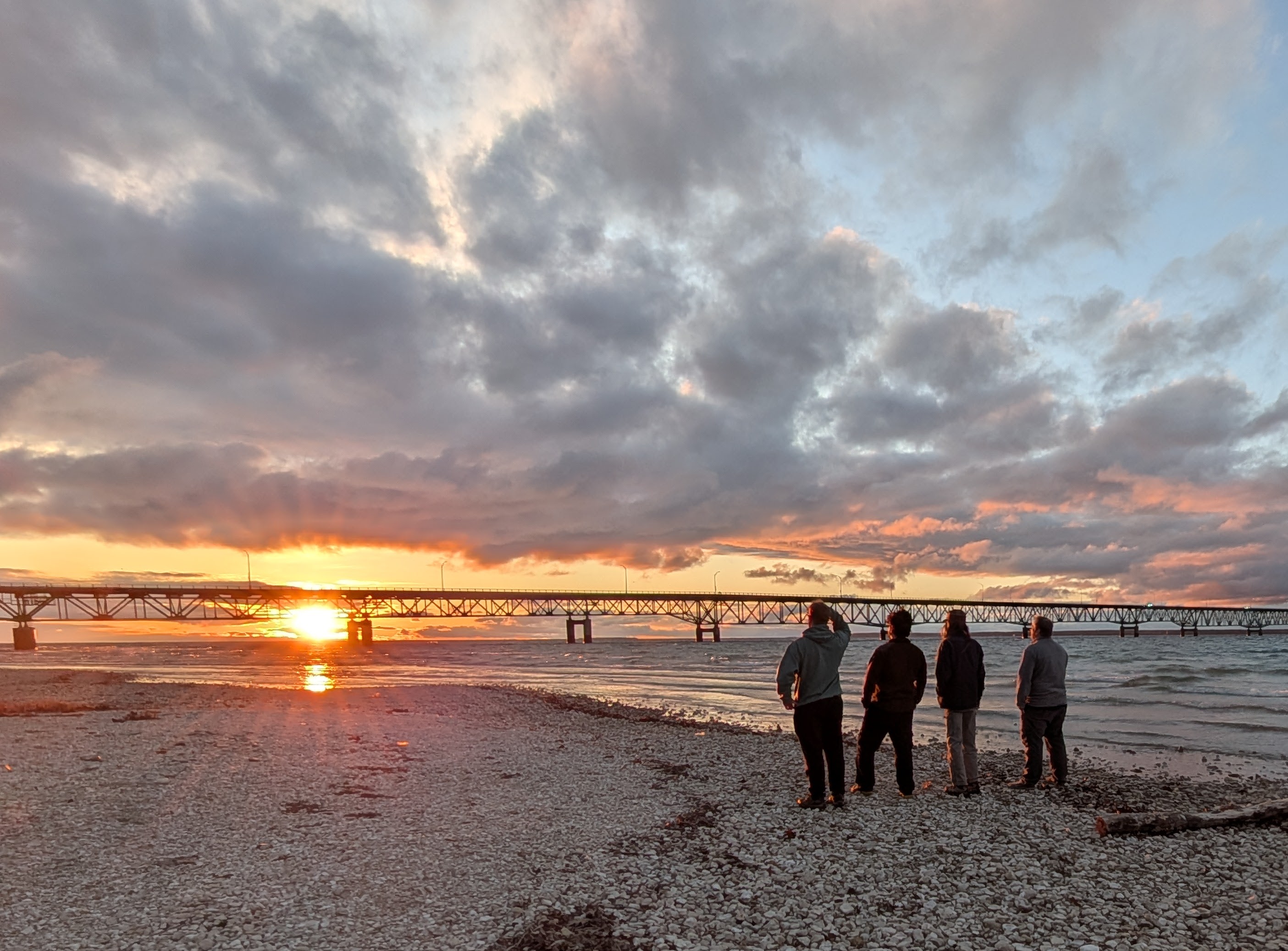 geoscience students look over the upper peninsula at sunset