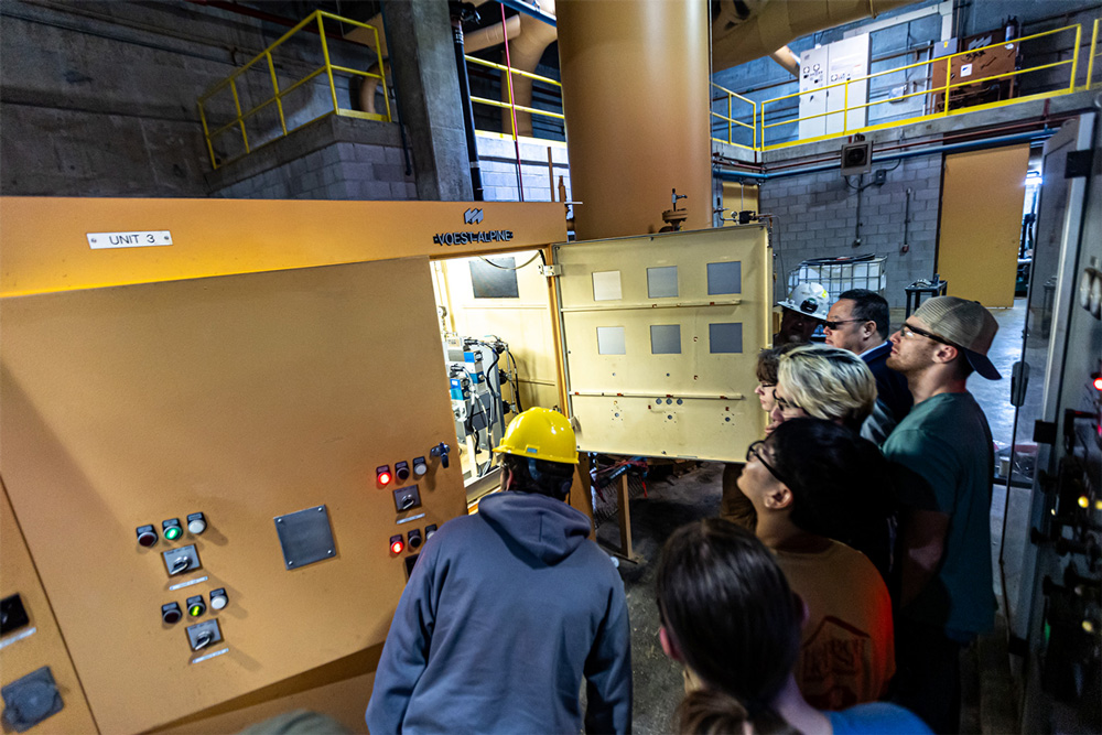 Students with IEEE check out machinery inside the James W. Trimble Lock and Dam.