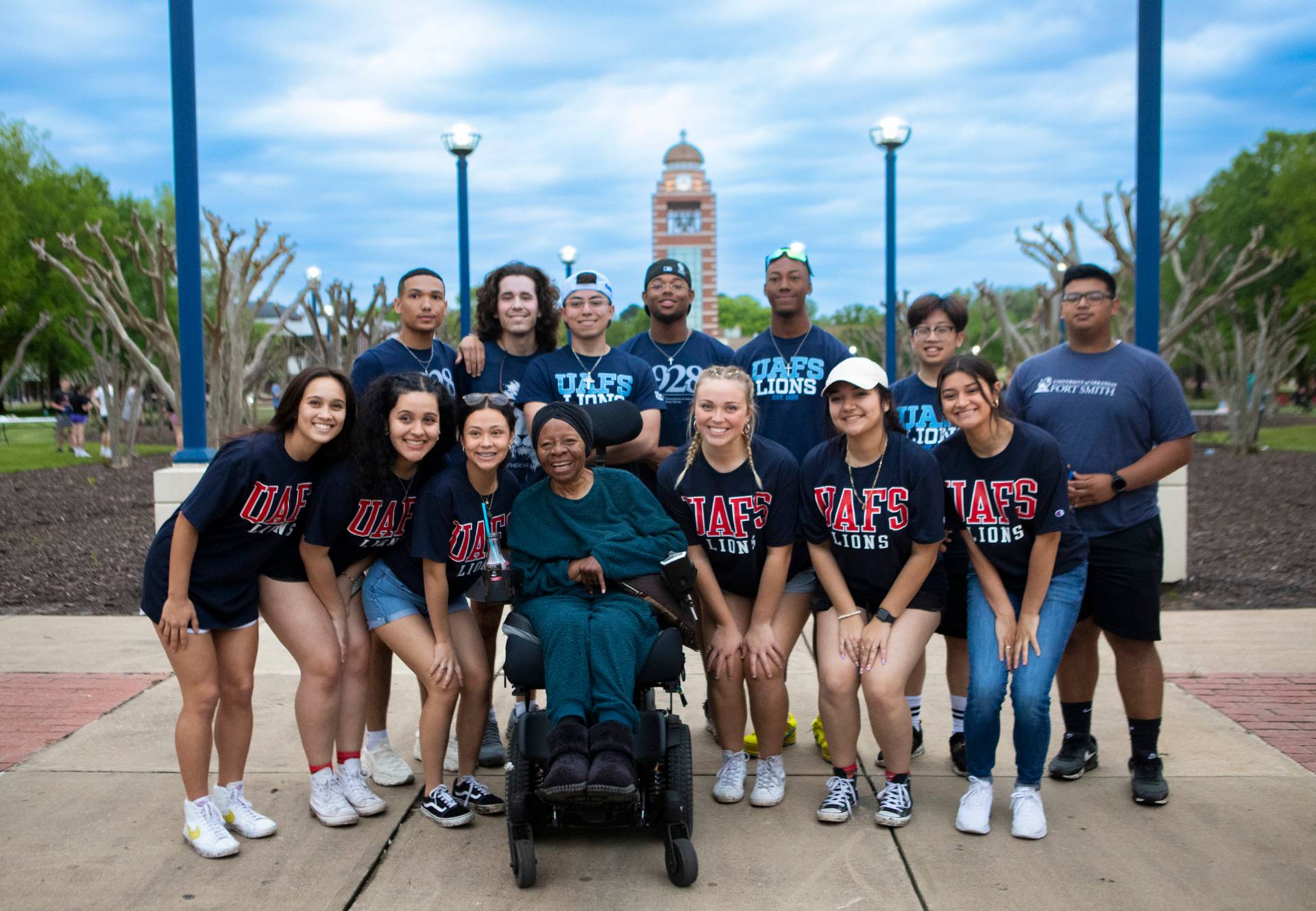 Charolette Tidwell poses with members of UAFS student organizations Men of Excellence and IDEAL Women during a campus kickball tournament held this spring in partnership with Antioch for Youth & Family.