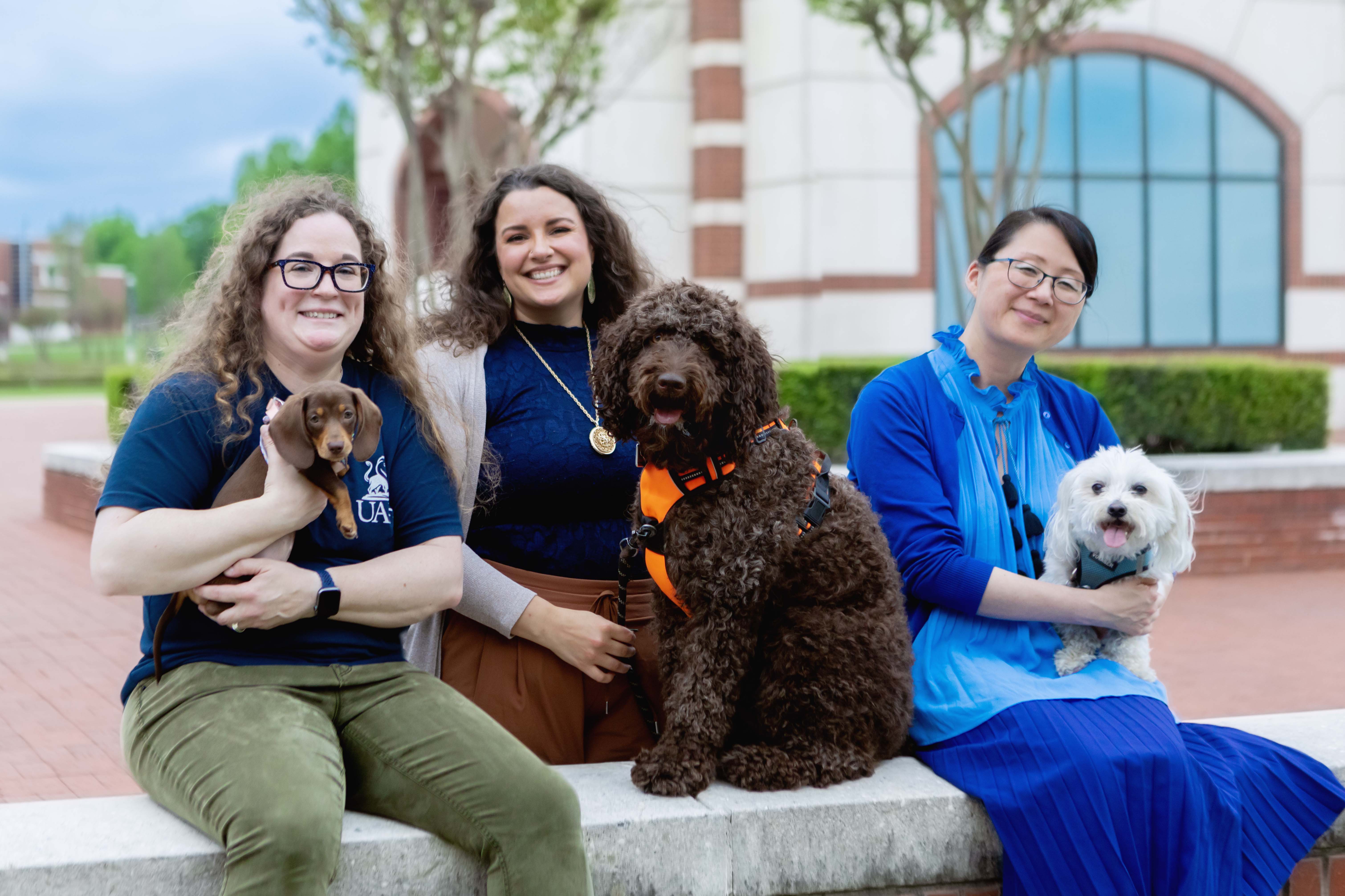 UAFS professors and puppies pose ahead of the UAFS Boreham Library's long night against procrastination event