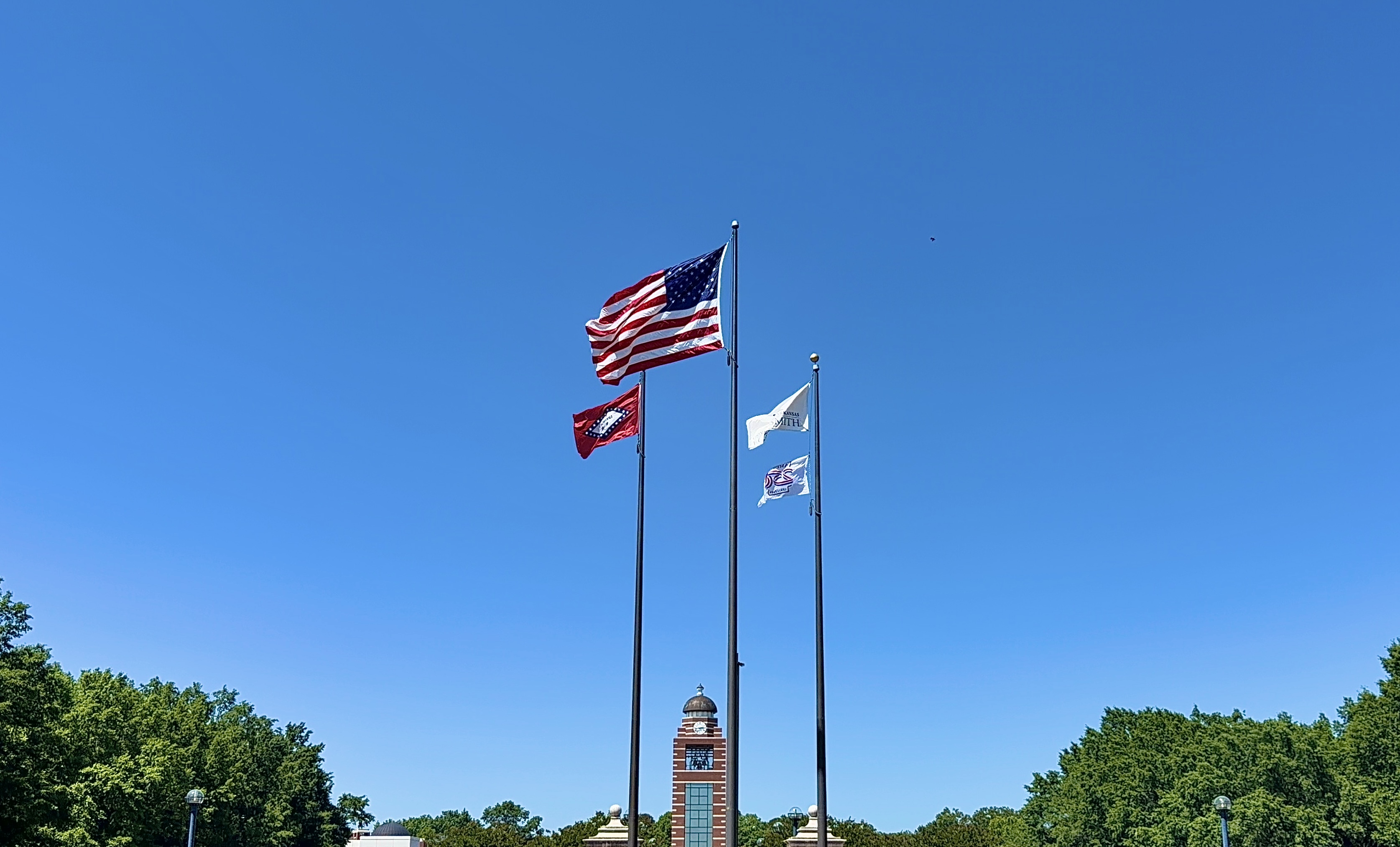 flags wave over the UAFS bell tower