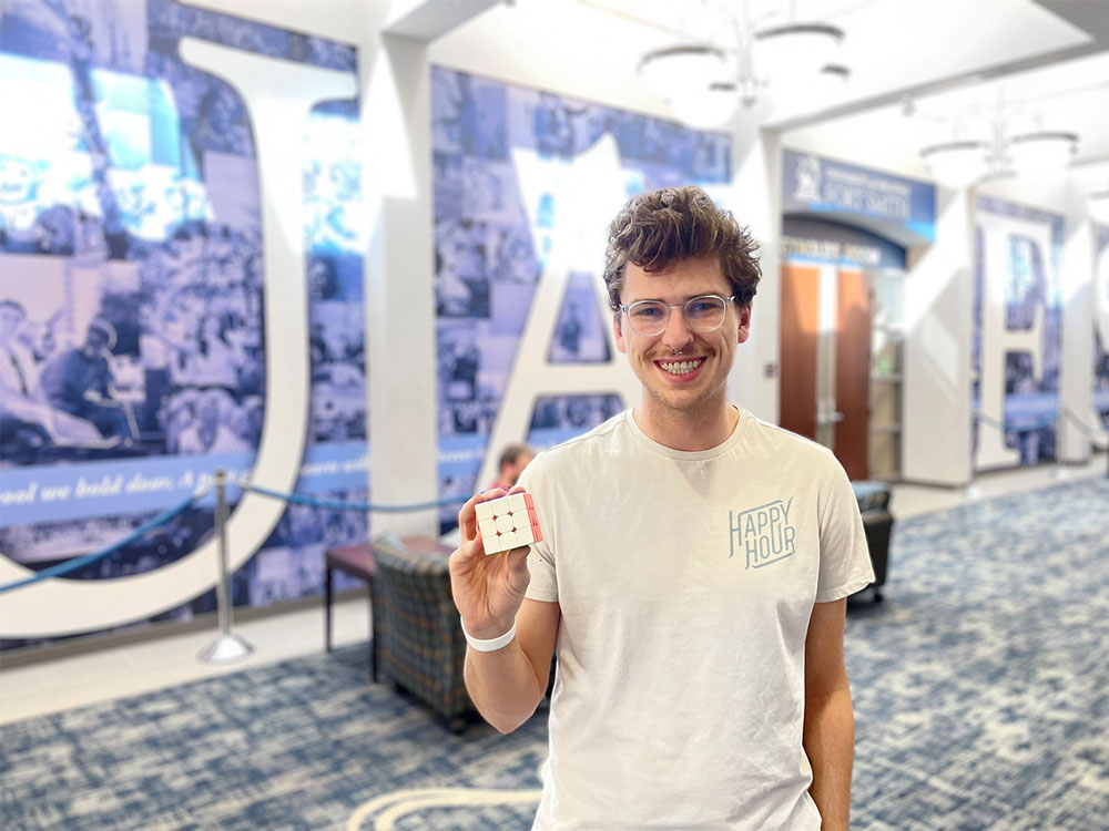 Michael Lander, sophomore music history major, and his speed cube in the UAFS Smith-Pendergraft Campus Center