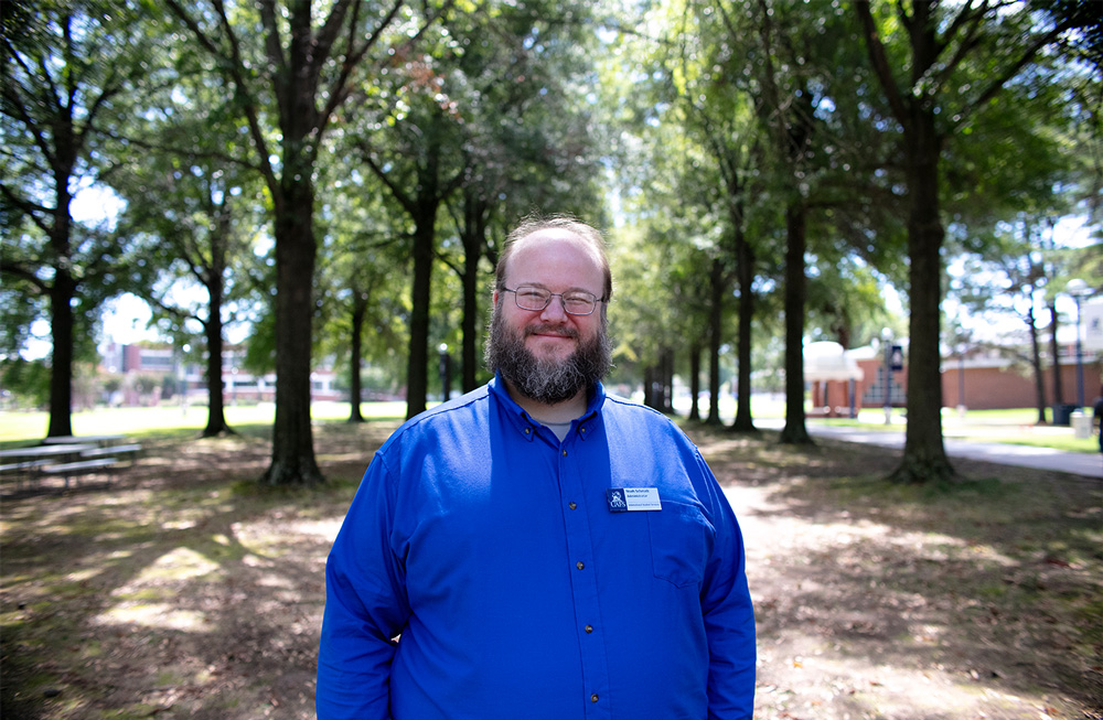 Portrait of Noah Schmidt in the UAFS Campus Green.