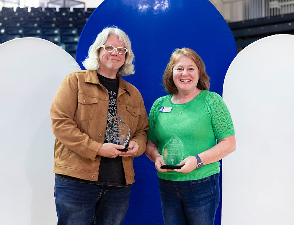 Left to right: Bryan Alexis and Susan Krafft accept their Student Government Association Faculty and Staff Appreciation Awards.