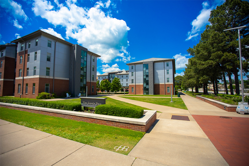 The Lion's Den Residence Halls at the University of Arkansas - Fort Smith on a bright summer day.