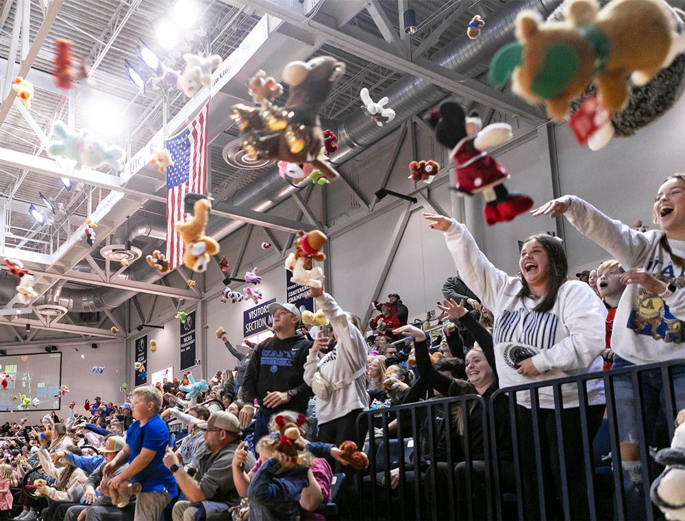 UAFS students, alumni, and fans throw soft toys onto the court at the Stubblefield Center for Toy Toss.