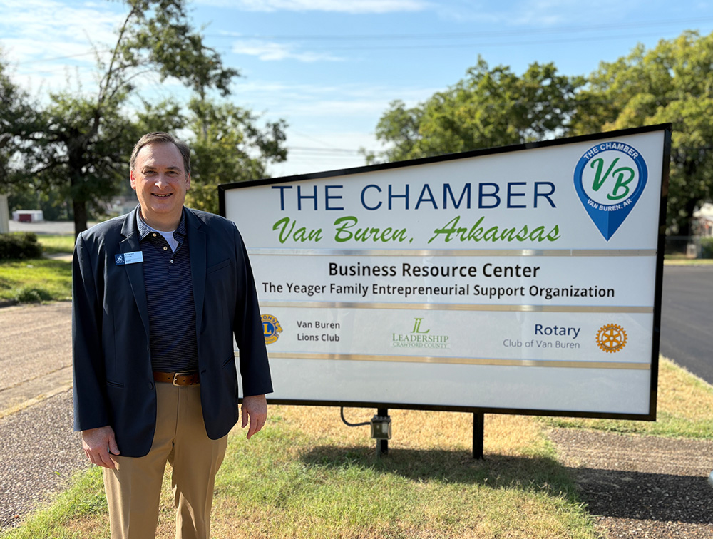 Ty Barrett, director for the ASBTDC regional office stands outside the new Van Buren Chamber of Commerce building