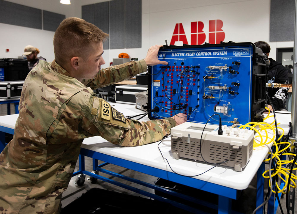 A student taking concurrent classes works in the ABB lab at PEAK Innovation Center