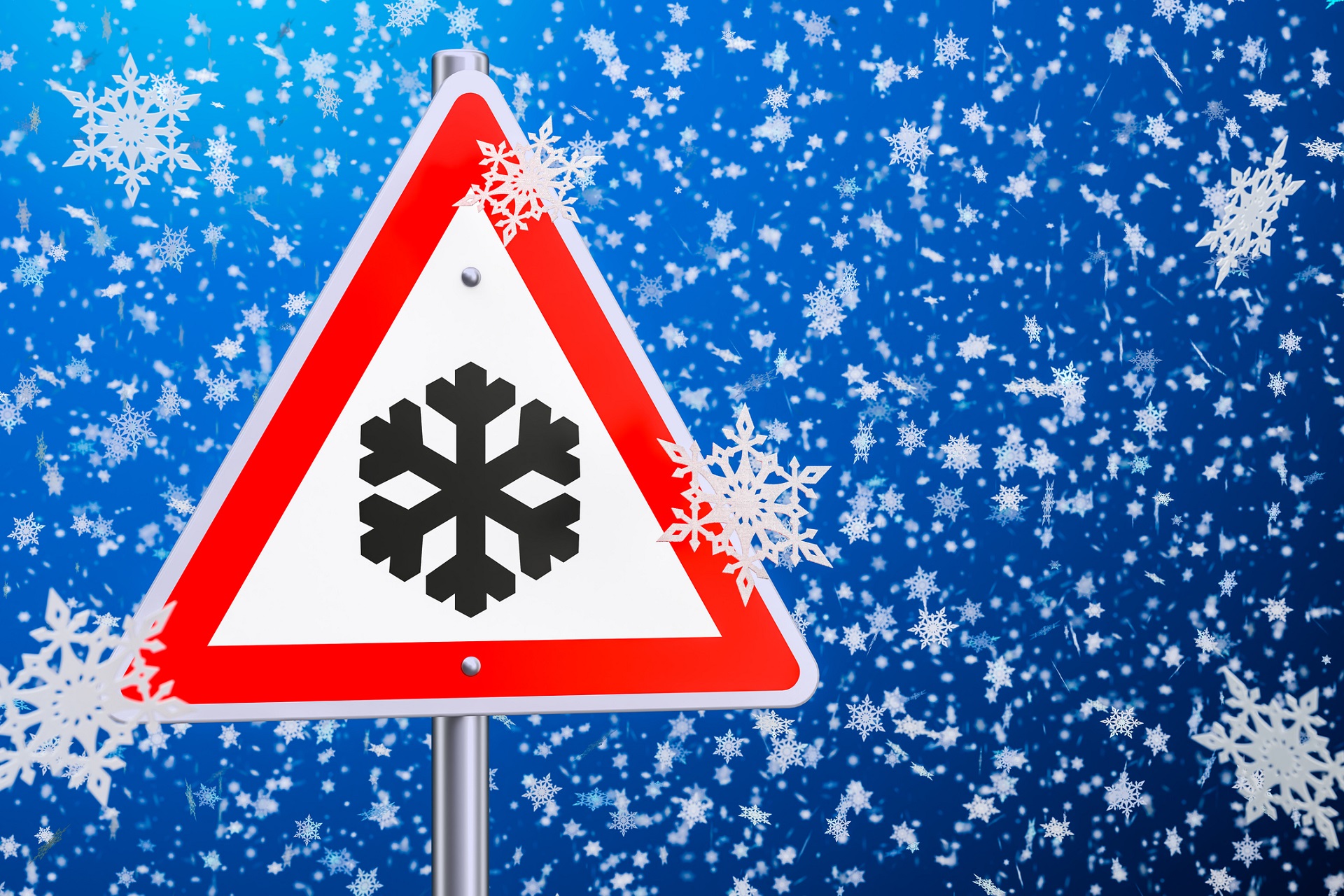 a caution sign with a snowflake