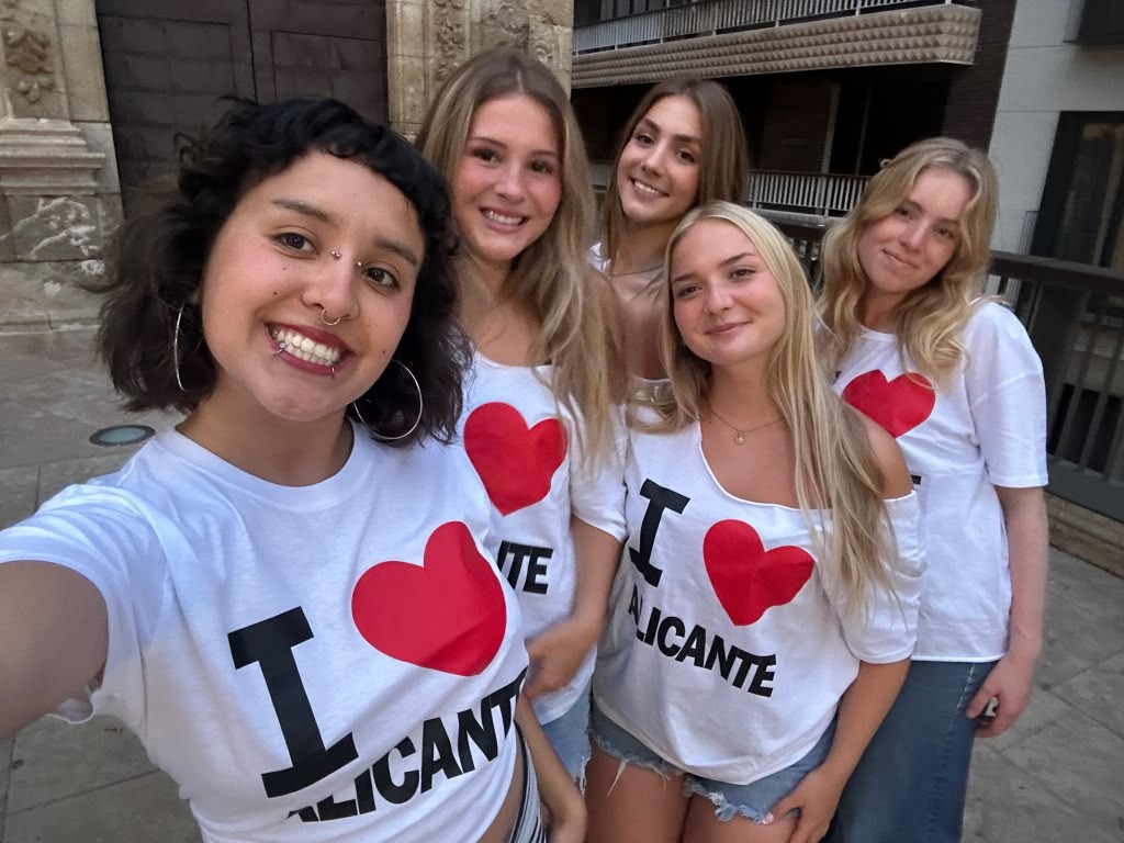 group of five female students pose in Spain